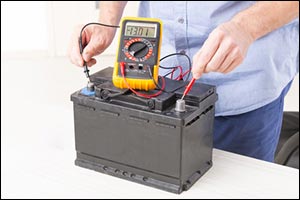 man checking car battery health