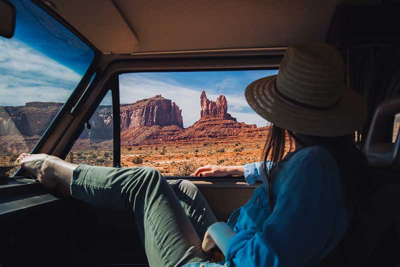 women on a monuntain road trip