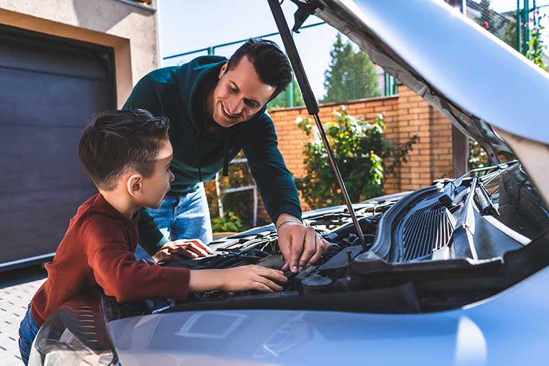 The father and son fixing the car